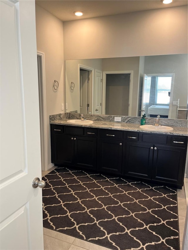 bathroom with tile patterned flooring and vanity