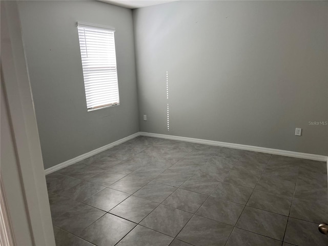 empty room featuring tile patterned floors