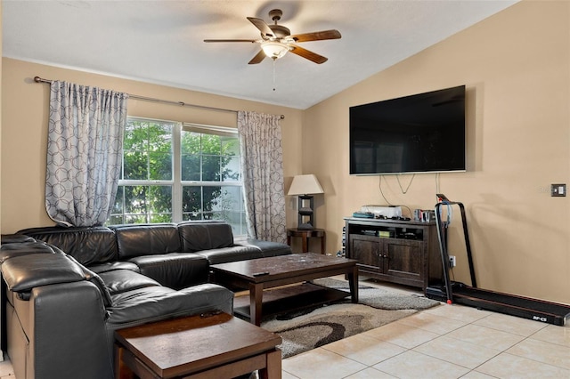 living area featuring vaulted ceiling, ceiling fan, and tile patterned floors