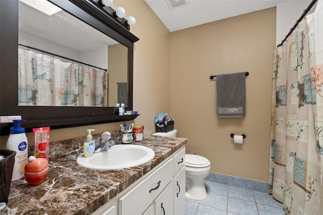 bathroom with toilet, visible vents, baseboards, vanity, and tile patterned floors