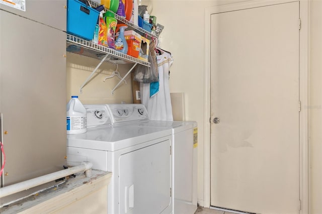 laundry room with laundry area and washing machine and clothes dryer