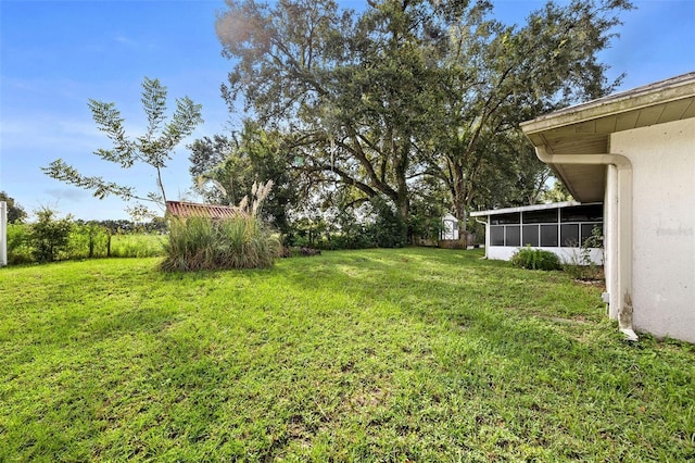 view of yard featuring a sunroom