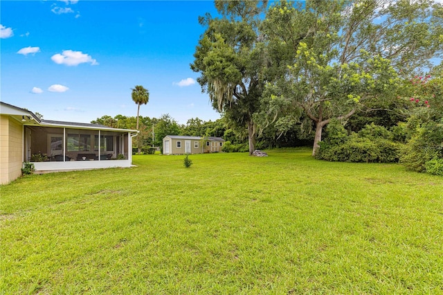 view of yard with a sunroom