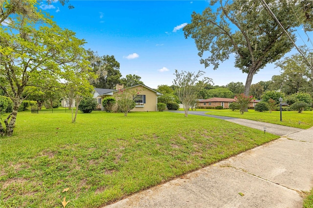 single story home featuring a front yard