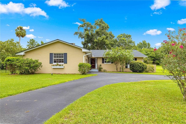 ranch-style home with a front yard