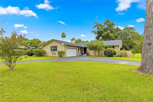 ranch-style home with a garage and a front yard