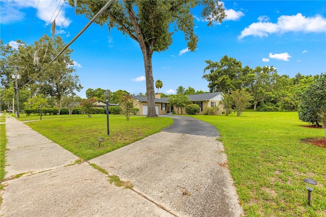 ranch-style home with a front yard