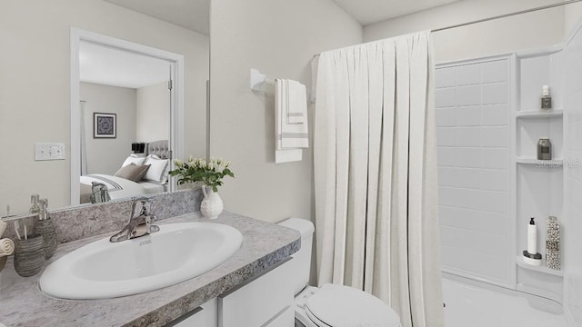 full bathroom with toilet, shower / tub combo with curtain, and vanity