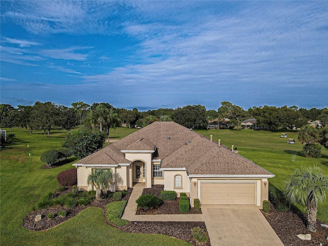 view of front of house featuring a front lawn, driveway, stucco siding, and an attached garage