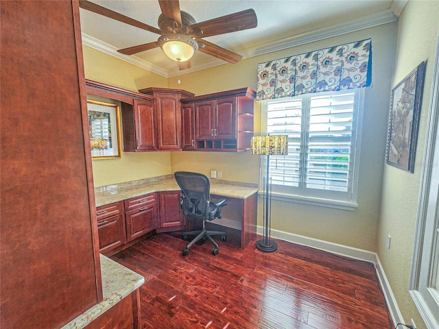 office area featuring crown molding, built in desk, ceiling fan, and dark hardwood / wood-style floors