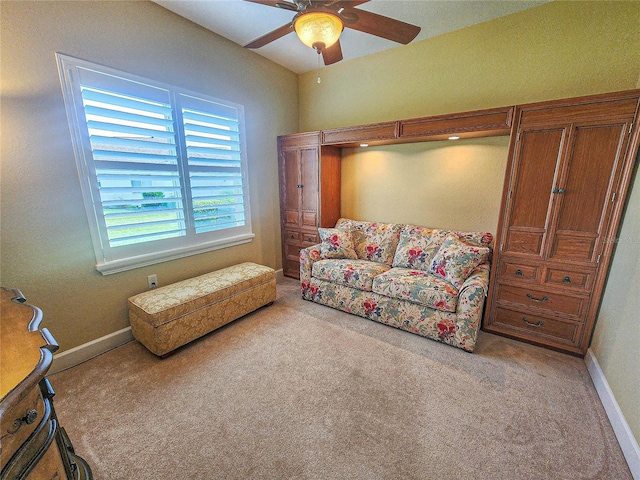 living room featuring ceiling fan and light carpet