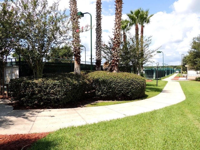 view of home's community featuring a yard