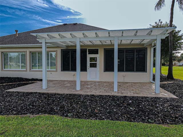 back of house featuring a pergola and a patio