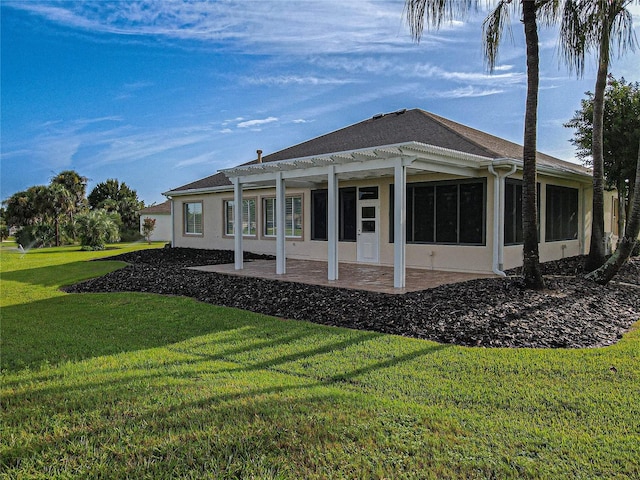 back of house featuring a yard