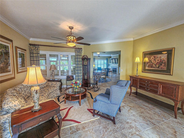 living room featuring crown molding, a textured ceiling, and ceiling fan