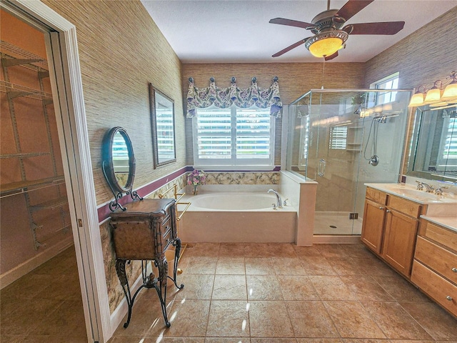 bathroom featuring vanity, separate shower and tub, and ceiling fan