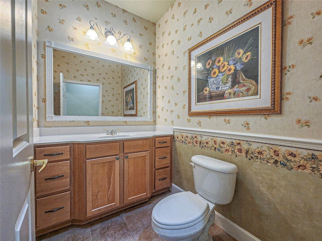 bathroom featuring vanity, toilet, and tile patterned flooring