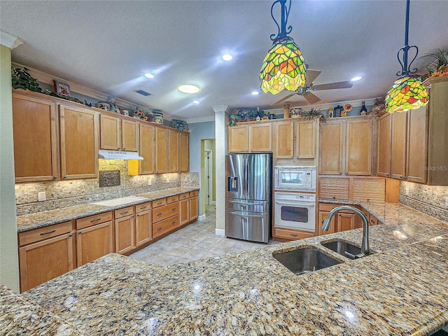 kitchen featuring ceiling fan, sink, white appliances, and kitchen peninsula