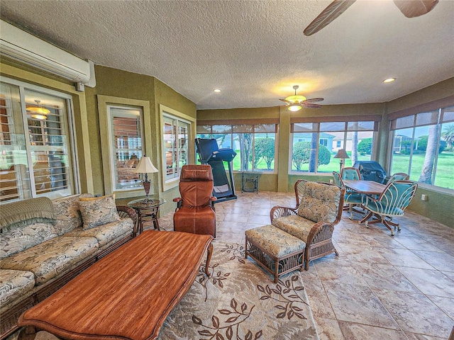 sunroom featuring ceiling fan