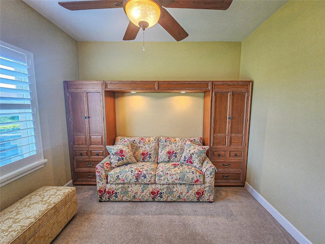 interior space with ceiling fan and carpet floors