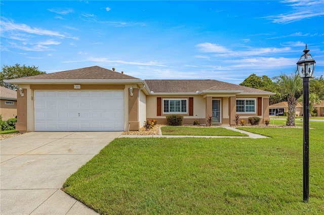 ranch-style home featuring a front lawn and a garage