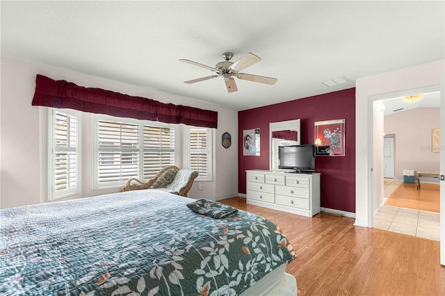 bedroom featuring light wood-type flooring and ceiling fan