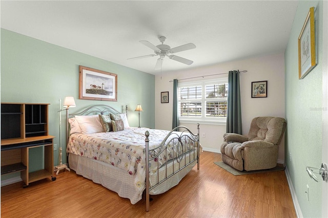 bedroom featuring hardwood / wood-style floors and ceiling fan