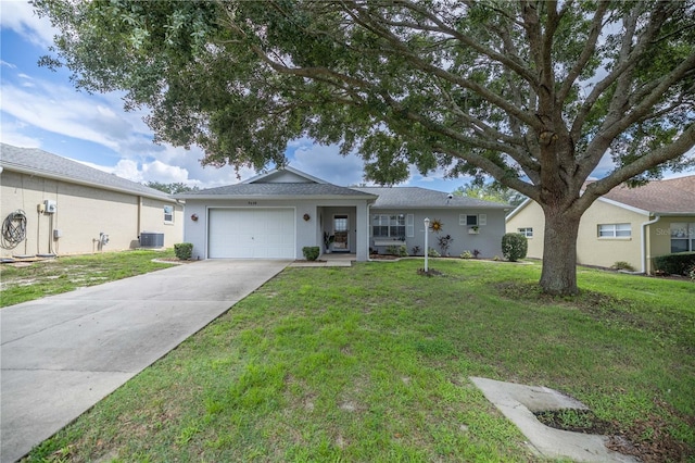 ranch-style home with central air condition unit, a garage, and a front lawn