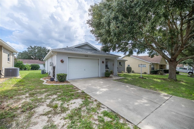 ranch-style house with a garage, a front yard, and central AC