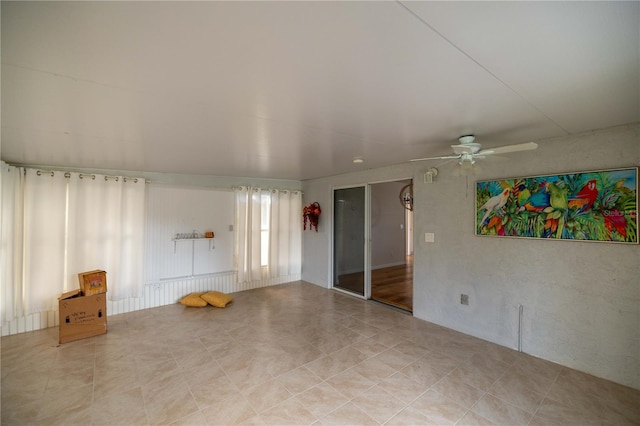 unfurnished room with ceiling fan