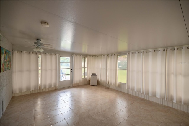 empty room with lofted ceiling and ceiling fan