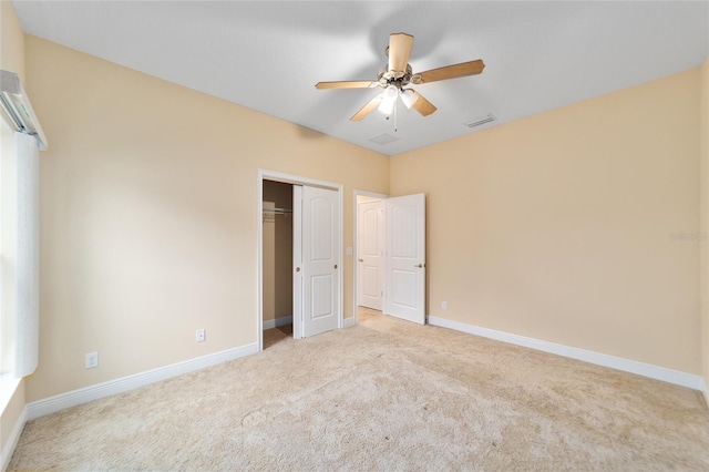 unfurnished bedroom with a closet, ceiling fan, and carpet flooring