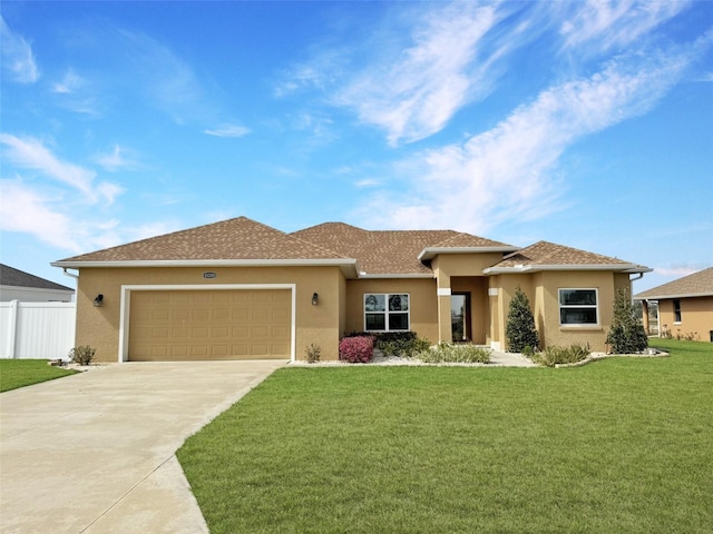 view of front of house featuring a garage and a front yard