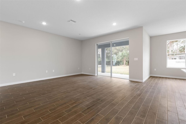 empty room featuring dark hardwood / wood-style flooring