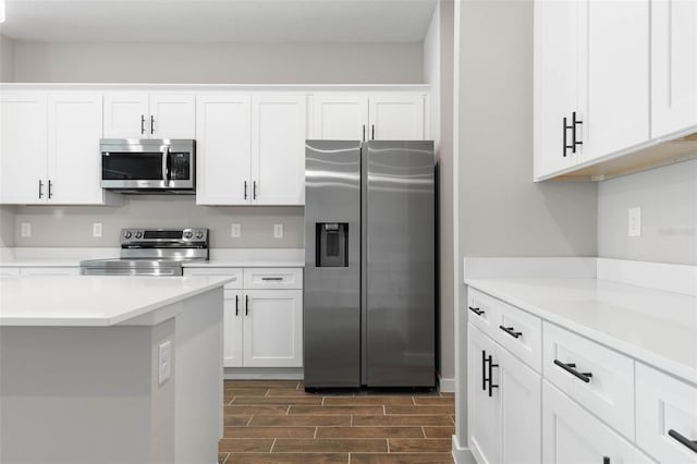 kitchen with stainless steel appliances and white cabinetry