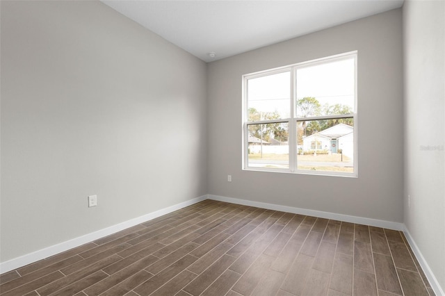 spare room featuring dark hardwood / wood-style floors