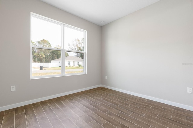 spare room featuring dark hardwood / wood-style floors