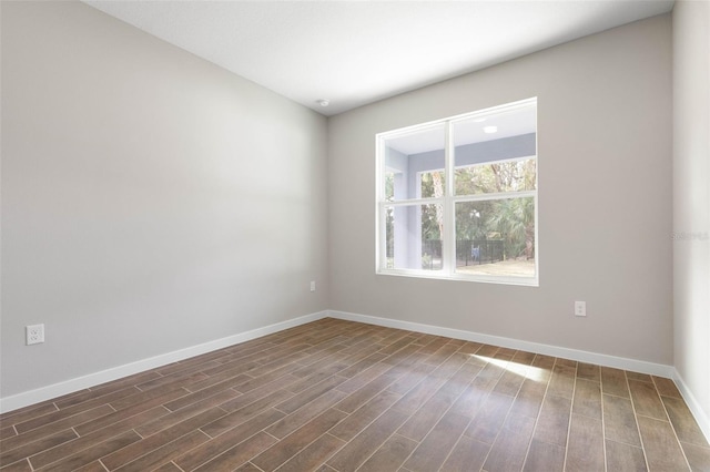 unfurnished room featuring dark hardwood / wood-style floors