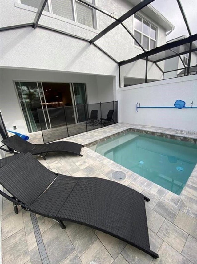 view of swimming pool featuring a patio area