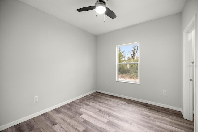 unfurnished bedroom featuring ceiling fan, light wood-style flooring, and baseboards