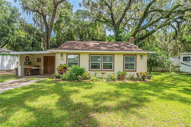 ranch-style home with a front yard