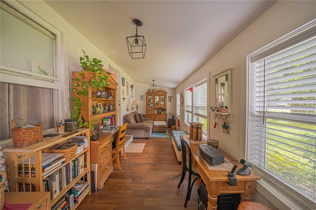 dining space with dark hardwood / wood-style flooring and vaulted ceiling