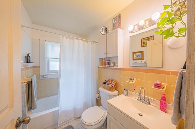 full bathroom with backsplash, toilet, tile walls, shower / bath combo with shower curtain, and vanity