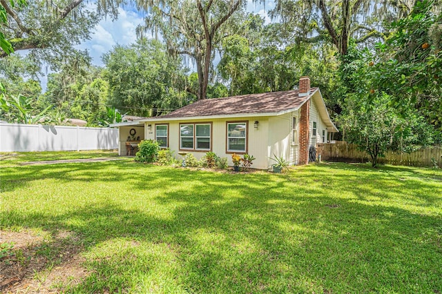 exterior space featuring a front yard