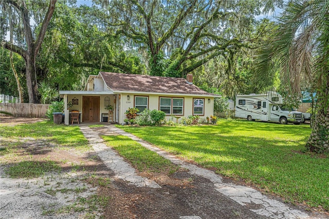 ranch-style house with a front yard