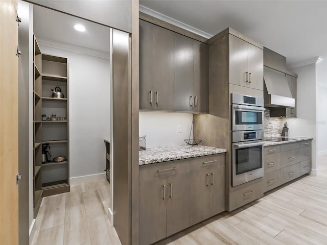 kitchen with decorative backsplash, double oven, black electric cooktop, and crown molding