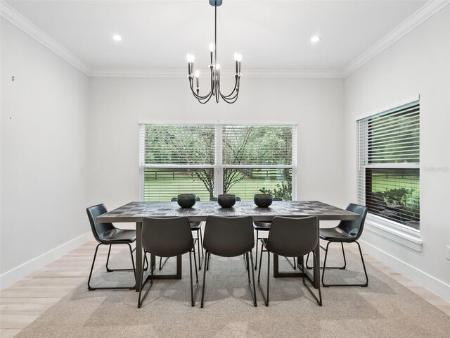 dining room with ornamental molding, recessed lighting, light wood-style floors, baseboards, and a chandelier