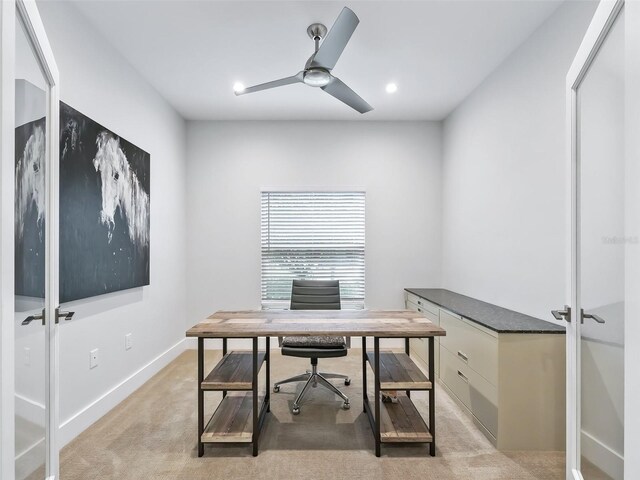 office featuring recessed lighting, a ceiling fan, baseboards, and light carpet