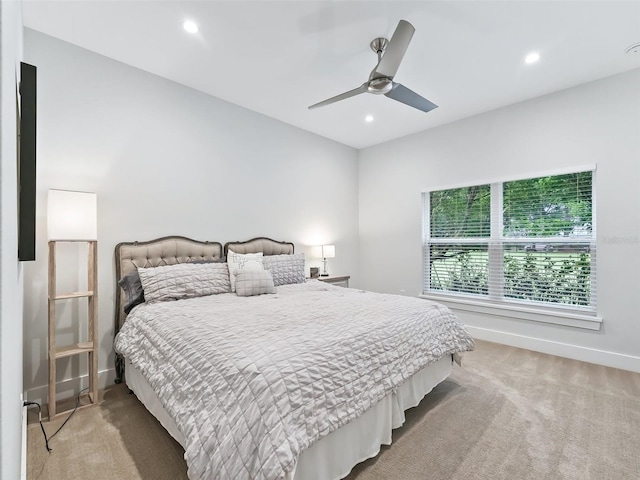 carpeted bedroom with ceiling fan