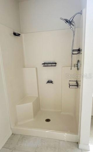 bathroom featuring tile patterned floors and walk in shower